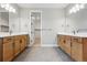 Spacious bathroom featuring double sinks with wood cabinets and tile flooring at 3370 Backdrop Ct, Castle Rock, CO 80108