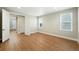 A well-lit bedroom with wood-look floors, a closet, and ample natural light from two windows at 3370 Backdrop Ct, Castle Rock, CO 80108