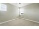 A carpeted bedroom with neutral walls and windows that provide ample natural light at 3370 Backdrop Ct, Castle Rock, CO 80108