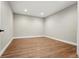 Minimalist bedroom with wood floors and recessed lighting at 3370 Backdrop Ct, Castle Rock, CO 80108