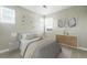 Modern bedroom with a plush bed, unique artwork, and neutral tones at 3370 Backdrop Ct, Castle Rock, CO 80108