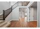 Welcoming entryway with hardwood floors, staircase, and open access to other rooms at 3370 Backdrop Ct, Castle Rock, CO 80108