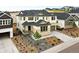Inviting two-story home featuring a covered porch, landscaped yard, and a two-car garage at 3370 Backdrop Ct, Castle Rock, CO 80108
