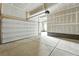 Spacious garage with overhead door and room for storage providing secure parking and extra space for vehicles and projects at 3370 Backdrop Ct, Castle Rock, CO 80108