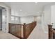 Upstairs hallway with wood railing at 3370 Backdrop Ct, Castle Rock, CO 80108