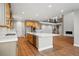 Open kitchen with a large center island and stainless steel appliances connects to the living area at 3370 Backdrop Ct, Castle Rock, CO 80108
