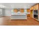 Modern kitchen features a center island, stainless steel appliances, and wood floors at 3370 Backdrop Ct, Castle Rock, CO 80108
