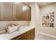 Convenient laundry room with ample cabinet space, a white countertop, and decorative dog art at 3370 Backdrop Ct, Castle Rock, CO 80108