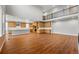Open-concept kitchen and living area featuring stainless appliances and island seating at 3370 Backdrop Ct, Castle Rock, CO 80108
