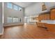Open concept living room with large windows and view to the kitchen area at 3370 Backdrop Ct, Castle Rock, CO 80108