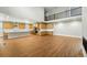 Open concept home with hardwood floors, oak cabinets, and island at 3370 Backdrop Ct, Castle Rock, CO 80108