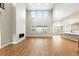 Spacious living room with fireplace, large windows, and hardwood floors at 3370 Backdrop Ct, Castle Rock, CO 80108