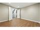 Spacious empty room with hardwood floors and an open stairway at 3370 Backdrop Ct, Castle Rock, CO 80108