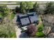 Stunning aerial view of the home showcasing landscaping, deck, and proximity to roads at 8277 Carriage Ln, Parker, CO 80134
