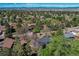 Scenic aerial view showing the home's setting amidst lush trees and neighborhood at 8277 Carriage Ln, Parker, CO 80134