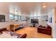 Spacious basement with a large television, comfortable seating, and ample room for entertainment at 8277 Carriage Ln, Parker, CO 80134