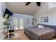 Cozy bedroom with a large bed, a work area, and access to a private balcony for relaxation at 8277 Carriage Ln, Parker, CO 80134