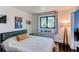 Cozy bedroom featuring natural light from the window and a calming color scheme at 8277 Carriage Ln, Parker, CO 80134