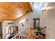 Bright foyer featuring hardwood floors, a wood ceiling, and plenty of natural light at 8277 Carriage Ln, Parker, CO 80134