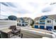 Balcony view of well-maintained townhouses with vibrant blue accents and attached garages at 1372 S Cathay Ct # 104, Aurora, CO 80017