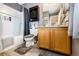 Bathroom featuring a tiled shower, vanity with sink, and wood-look flooring at 1372 S Cathay Ct # 104, Aurora, CO 80017