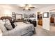 Primary bedroom featuring a ceiling fan, window, neutral wall color, carpeted floors, and furnishings at 1372 S Cathay Ct # 104, Aurora, CO 80017