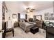 Bedroom with ceiling fan, window, neutral wall color, carpeted floors, and furnishings at 1372 S Cathay Ct # 104, Aurora, CO 80017