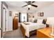 Bedroom featuring a ceiling fan, and well-lit room with carpeted floors at 1372 S Cathay Ct # 104, Aurora, CO 80017