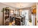 Stylish dining area featuring modern furniture, a bar, and natural light at 1372 S Cathay Ct # 104, Aurora, CO 80017