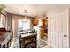 Inviting dining room with stylish decor, open to the kitchen, and flooded with natural light at 1372 S Cathay Ct # 104, Aurora, CO 80017