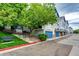 Charming townhomes with blue accents, well-maintained landscaping and street parking at 1372 S Cathay Ct # 104, Aurora, CO 80017
