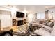 Cozy living room with a fireplace, built-in shelves, and comfortable seating area at 1372 S Cathay Ct # 104, Aurora, CO 80017