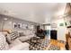 Inviting living room with hardwood floors, comfortable seating, and dining area views at 1372 S Cathay Ct # 104, Aurora, CO 80017