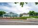 Community pool with glass enclosure, surrounded by landscaped grounds and trees, offering year-round enjoyment at 1372 S Cathay Ct # 104, Aurora, CO 80017