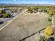 A scenic aerial perspective showcasing the property's proximity to local amenities, street access, and neighborhood at 6365 W Coal Mine Ave, Littleton, CO 80123