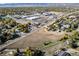 An overhead view displays a neighborhood set between businesses and residences at 6365 W Coal Mine Ave, Littleton, CO 80123