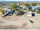 Aerial view features barn and residence with mature trees in a large lot ready for development with room for your ideas at 6365 W Coal Mine Ave, Littleton, CO 80123