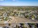 An aerial view shows houses, trees and open fields in a wide spread neighborhood at 6365 W Coal Mine Ave, Littleton, CO 80123