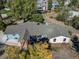 A closer aerial view shows the deck, blue siding, and roof lines on the home at 6365 W Coal Mine Ave, Littleton, CO 80123