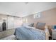 Bedroom featuring stylish sliding doors and French doors that lead to the outside at 6365 W Coal Mine Ave, Littleton, CO 80123