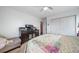 Cozy bedroom featuring a comfortable bed, dresser, and spacious closet for ample storage at 6365 W Coal Mine Ave, Littleton, CO 80123