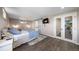 Bedroom featuring sliding doors, stylish decor and a window for plenty of natural light at 6365 W Coal Mine Ave, Littleton, CO 80123