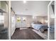 Bedroom featuring stylish sliding doors and French doors that lead to the outside at 6365 W Coal Mine Ave, Littleton, CO 80123