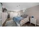 Bedroom featuring stylish sliding doors and French doors that lead to the outside at 6365 W Coal Mine Ave, Littleton, CO 80123