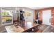 Cozy dining area featuring natural light, a rustic wooden table, and a welcoming atmosphere at 6365 W Coal Mine Ave, Littleton, CO 80123