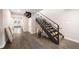 Hallway entrance featuring wood floors, stairs and framed art creates a visually stunning focal point at 6365 W Coal Mine Ave, Littleton, CO 80123