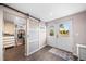 Hallway featuring sliding doors to closet and French doors that lead to the outside at 6365 W Coal Mine Ave, Littleton, CO 80123