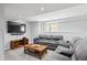 Finished basement offering a cozy seating area and entertainment space at 15357 Flowergate Way, Parker, CO 80134