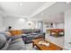 Spacious finished basement with wet bar, pool table, and comfortable seating at 15357 Flowergate Way, Parker, CO 80134