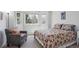 Cozy bedroom with a comfortable chair and plenty of natural light at 15357 Flowergate Way, Parker, CO 80134